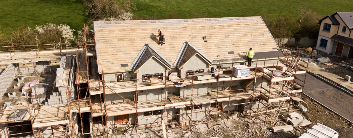 Roof repairmen initializing roof damage control and repair after a storm