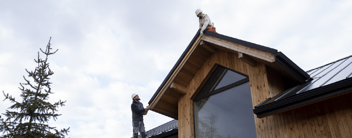 Roof repairmen doing measurements before actual shingle roof repair